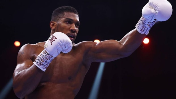 Anthony Joshua taunts during the Heavyweight fight between him and Otto Wallin during the Day of Reckoning in Riyadh, Saudi Arabia. Joshua says he has  agreed to fight Tyson Fury and Deontay Wilder in the past, so he won't back down. RICHARD PELHAM/GETTY IMAGES. 